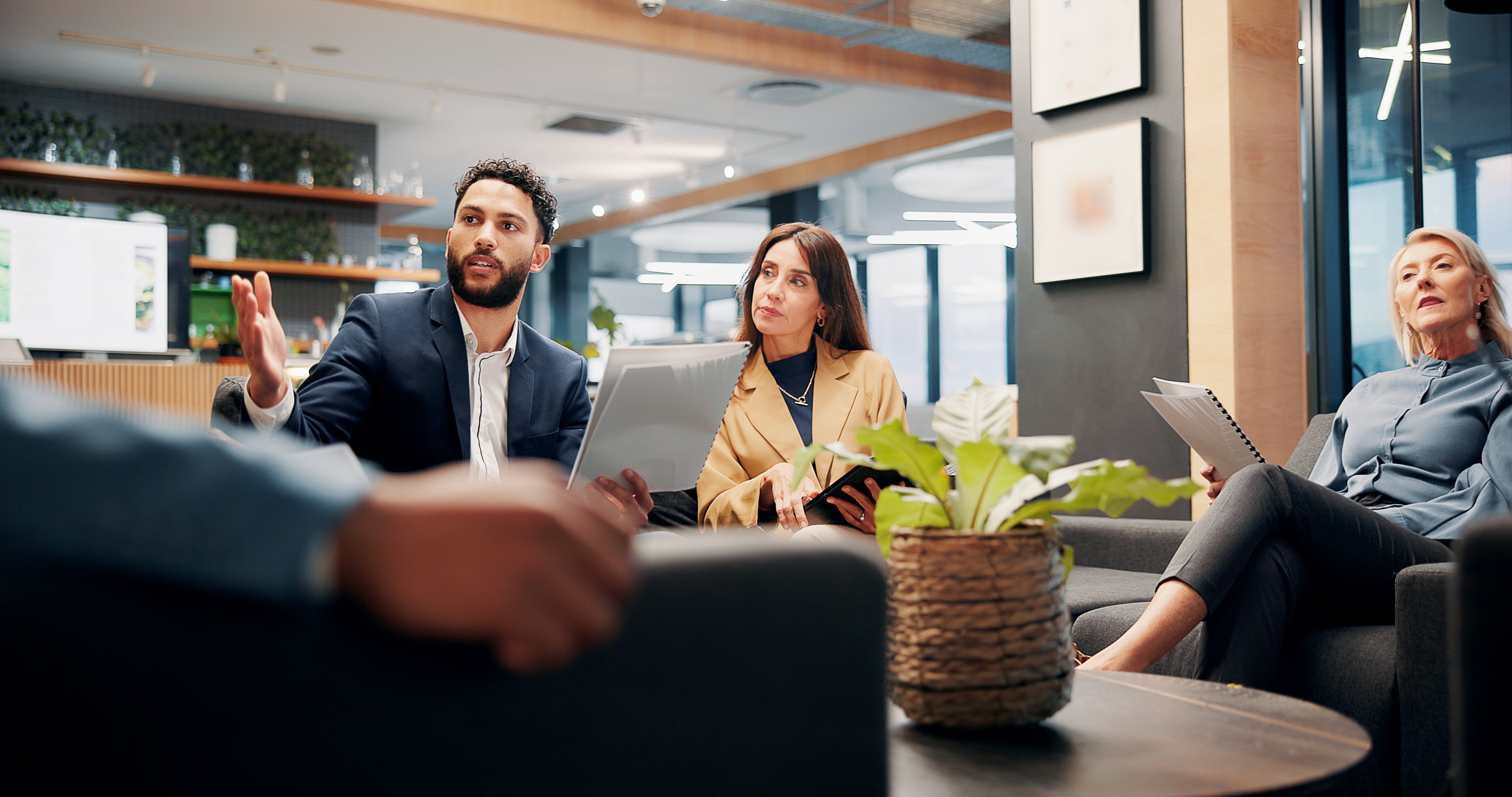 A work team in an open office during a meeting.