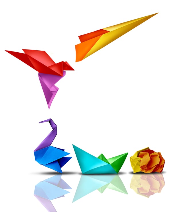 Rainbow paper origami shifting from a crumpled ball to a boat, crane, flying bird and lastly a launched paper airplane.